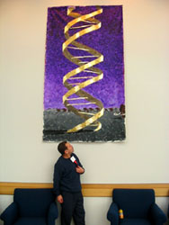 The artist in front of his painting on exhibition at the National Undergraduate Bioethics Conference, "Genetics, Life Sciences and Art", University of Michigan, Ann Arbor, March 2004.