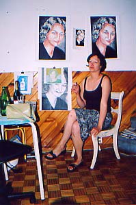Nancy posing in front of her portraits, Montreal June 04.